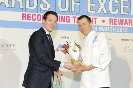 <br />Executive Chef Arnaud Thulliez of Ritz-Carlton, Millennia Singapore receives the Bernardaud Executive Chef of the Year trophy from Thibault Pointe, Vice President Sales & Marketing Asia Pacific of Bernardaud. <br />